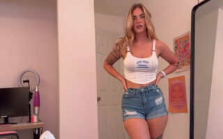 She is wearing denim shorts!