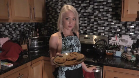 She is wearing only kitchen apron