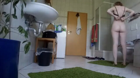 Hidden cam still of a stepsister with a perfect body inserting a tampon in the bathroom after a shower, voyeur taboo video thumbnail
