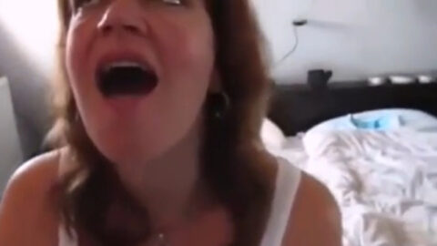 Amateur mother on her knees giving her real son a sloppy blowjob and eating his warm load