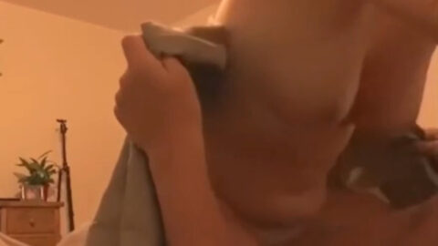 Real mother straddling her son beneath a rumpled blanket, hips mid-grind, both hiding under the sheets during secret incest fucking