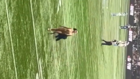 Nude girl sprinting down a football field in a funny voyeur moment