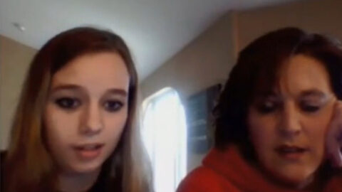 Mother and daughter posing side by side on webcam during live family stream
