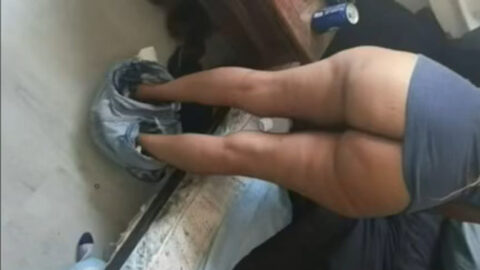 Amateur mom leaning close to her son on a worn couch during a taboo home encounter