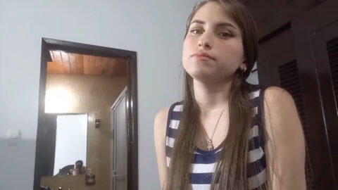 Young sister on her knees giving her older brother a sloppy blowjob in the living room while parents are away